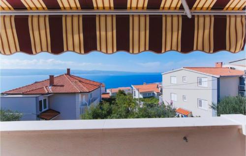 a view of the ocean from a balcony at Nice Apartment In Omis With Wifi in Tice