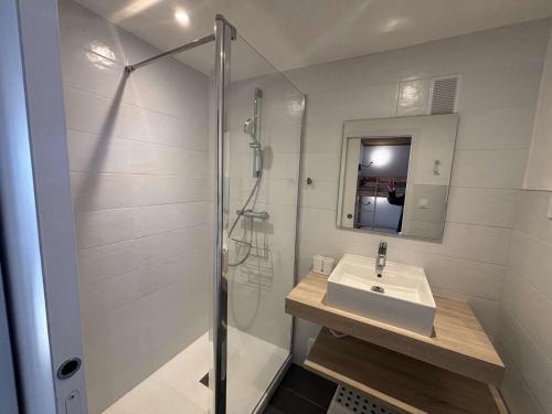 a bathroom with a sink and a shower at Charmant 2 pièces 6 pers avec balcon sud, proche télé-siège et commerces à l'Alpe d'Huez - FR-1-405-3 in L'Alpe-d'Huez