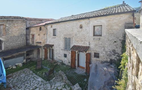 a view of an old stone house from the street at 4 Bedroom Stunning Home In Montenero Val Cocchiar in Montenero Val Cocchiara