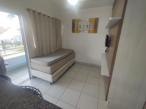 Ένα ή περισσότερα κρεβάτια σε δωμάτιο στο Flats Lacqua diRoma Roberto Imoveis