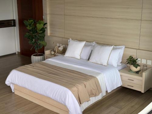 Ένα ή περισσότερα κρεβάτια σε δωμάτιο στο Emville - Villa in Cochin