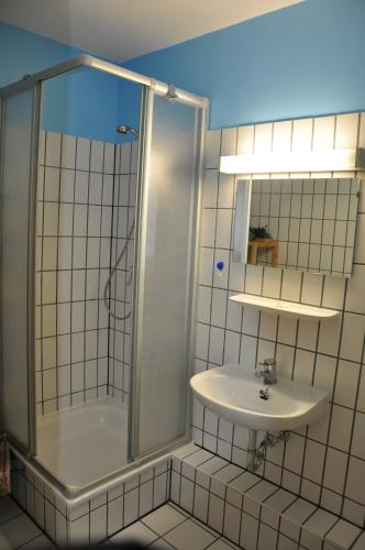 a bathroom with a shower and a sink at Ferienwohnung 212 Lagunenstadt in Ueckermünde