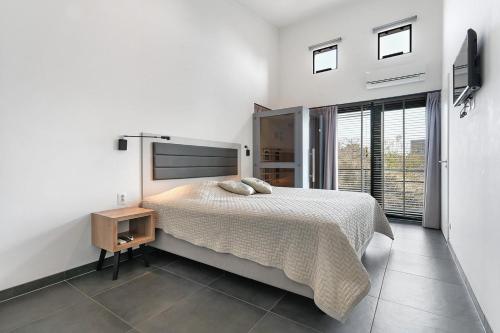 Postel nebo postele na pokoji v ubytování Villa Super VIP | 4 Pers. (Villa 5) met jacuzzi, extra kosten voor gebruik