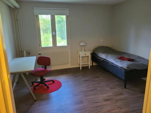 Ένα ή περισσότερα κρεβάτια σε δωμάτιο στο Storgatan 61 Jokkmokk