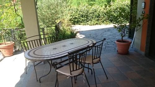 a table and chairs sitting on a patio at Casa dei Mulini in Mergozzo