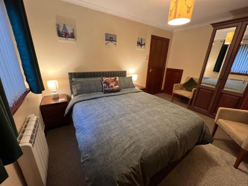 Voodi või voodid majutusasutuse The Cottage at Craigavon House toas