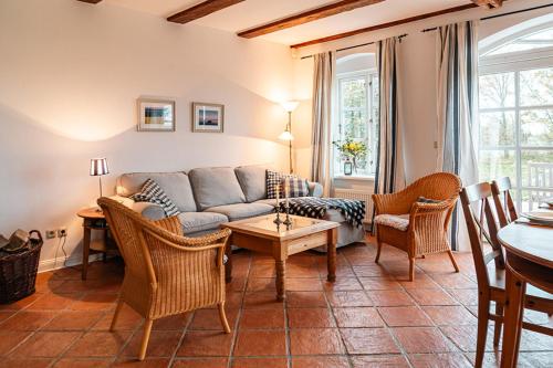 a living room with a couch and a table at Ferienwohnung "Wildgans" in Schaprode