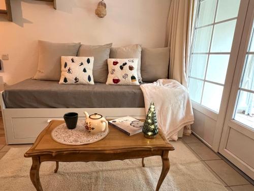 Et opholdsområde på Joli appartement au golf