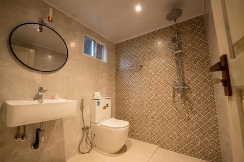 Ένα μπάνιο στο Oasia By Oasis Negombo