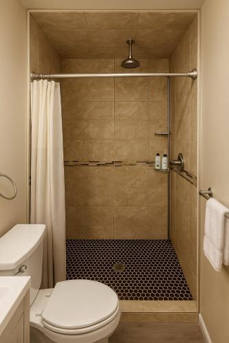a bathroom with a shower with a toilet at Dillon Ave Homes in Cheyenne