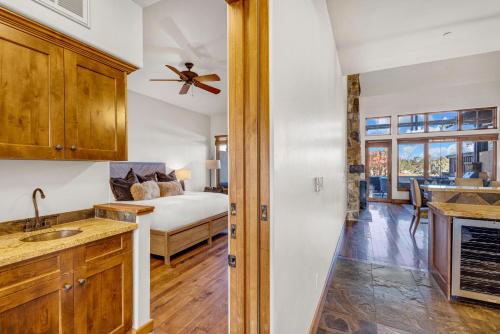 a kitchen and living room with a bed in a room at Upscale 3 BR Townhouse @ Juniper Preserve Resort in Bend