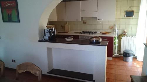 a kitchen with a stove and a counter top at Casa dei Mulini in Mergozzo