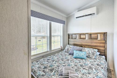 a bedroom with a bed and a window at Tranquil Trails Cabin & Suites Spring Midweek 35 Off in Pleasant Mount