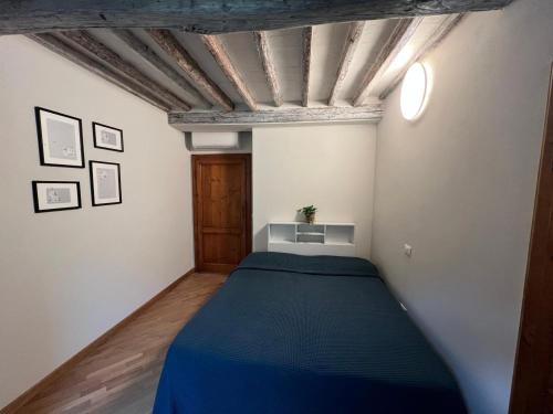 Ένα ή περισσότερα κρεβάτια σε δωμάτιο στο Tavoleria Pisa City Center