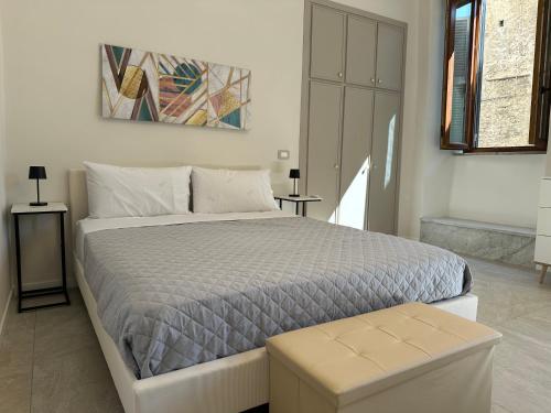 a bedroom with a large bed with at Residenza Aurea Tivoli in Tivoli