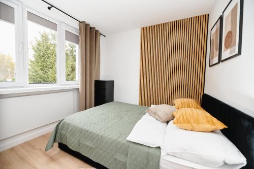 Giường trong phòng chung tại Zefir Apartment