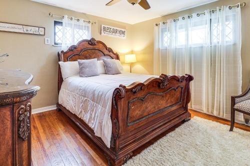 a bedroom with a large wooden bed in a room at 3 Mi to South Park Quiet Pittsburgh Area Getaway in Option