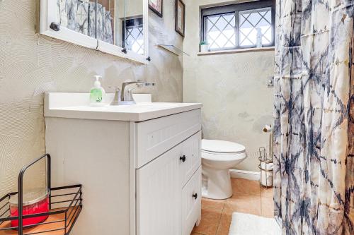 a bathroom with a sink and a toilet at 3 Mi to South Park Quiet Pittsburgh Area Getaway in Option