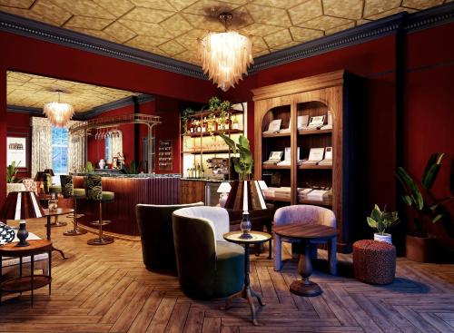 a restaurant with a bar with chairs and tables at Bertrand's Townhouse in London