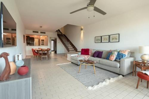 a living room with a couch and a table at Selah in Palmas del Mar in Buena Vista