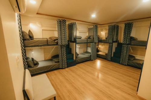 a room with four bunk beds in it at Jai Kutir Homestay - Hawa Mahal View in Jaipur