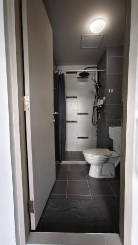 a bathroom with a toilet and a sink at D Condo mine Kathu in Kathu