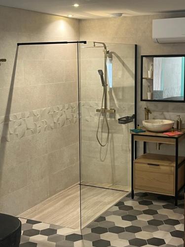 a bathroom with a shower and a sink at bulles et détente in Seuil