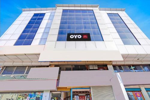 a building with an ovo sign on it at Hotel O Indian Suites in Bengaluru