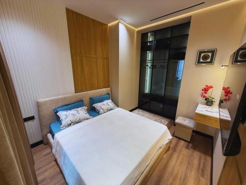 Ένα ή περισσότερα κρεβάτια σε δωμάτιο στο NestOne - Apartment hotels