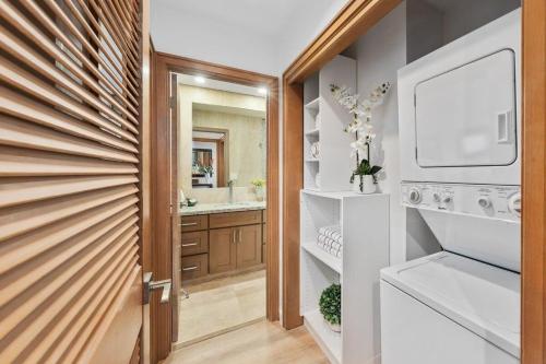 a bathroom with a sink and a mirror at Kapalua Ridge Villas 1612 · KRV 1612 Remodeled Kapalua Villa w O in Kahana