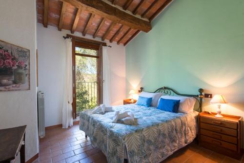 Ένα ή περισσότερα κρεβάτια σε δωμάτιο στο Podere La Tona