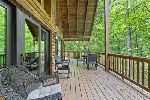a porch of a house with chairs and a table at Hot Tub & WiFi - Birdsong - Red River Gorge KY in Stanton