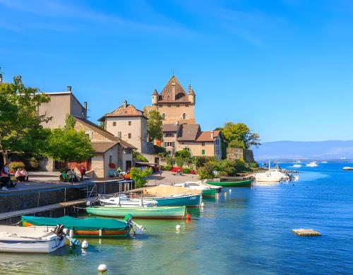 a group of boats docked in a river with a castle at Petit chalet proche Lac Léman in Sciez