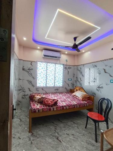 a bedroom with a bed in a room at Mayapur Yatri Nivas in mayapur