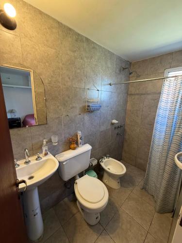 a bathroom with a sink and a toilet and a shower at Alojamiento cerca de rios, montañas y naturaleza in Salta