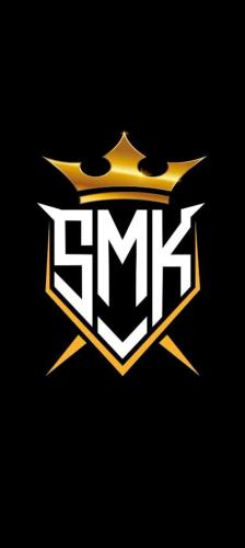 a gold and white gmt logo on a black background at SMK homestay in Rāmeswaram