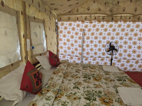 a bedroom with a bed in a room at White Thar Camp in Dhordo