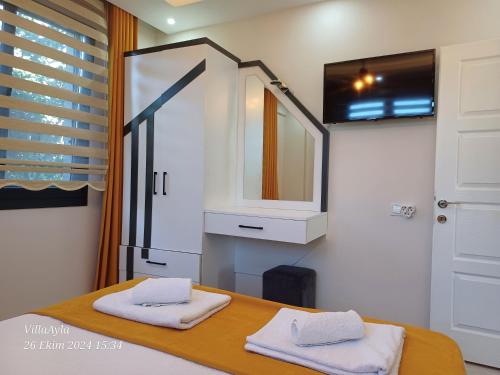 a bathroom with a sink and a mirror at Villa Ayla in Fethiye