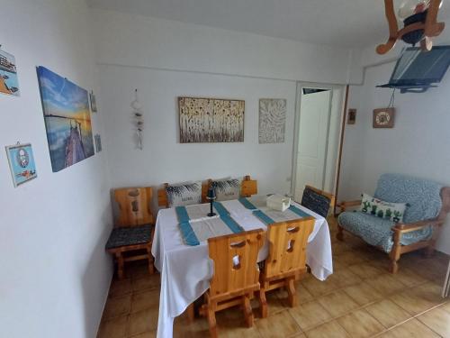 a dining room with a table and chairs at Sounio Seaside Residence by the Temple of Poseidon in Sounio