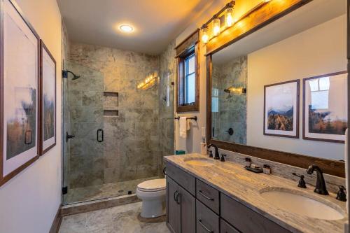 a bathroom with a sink and a shower and a toilet at Overlook Nook at Eagles Nest in Elk Park