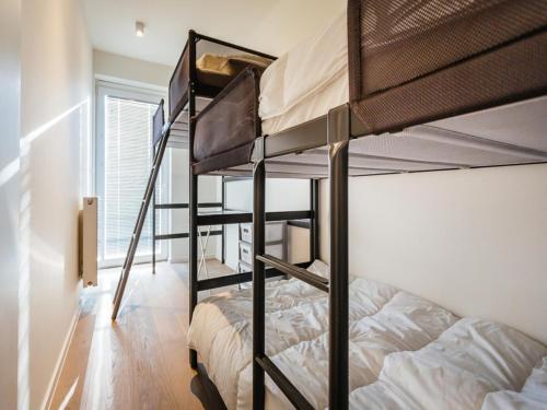 a bunk bed room with two bunk beds at LaVue premier in Galopen