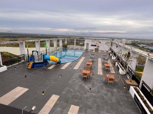 a cruise ship with a pool and a slide at AnR Studio Suite Inside H Elite Building in Kota Bharu