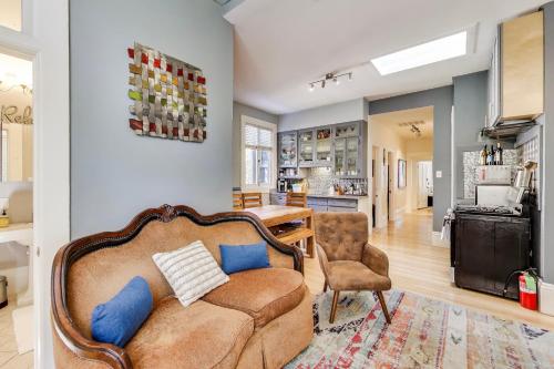 a living room with a couch and a kitchen at LIVE IT UP In The Castro! 4BRWDWalk Score 98 in San Francisco
