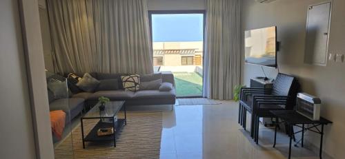 Posezení v ubytování منتجع جبل السيفة