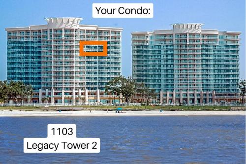 two large tall buildings next to a body of water at Beachview Condo at Legacy Tower 2 -1103 - fully furnished 2 bedroom 2 bath in De Buys