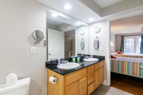 a bathroom with two sinks and a large mirror at Cozy 2 bed 2 bath condo at the beachside Ocean Club Villas in Beauvoir