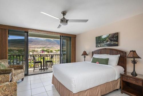 a bedroom with a bed and a balcony at Lahaina Shores 306 · LS 306 Dream Maui Studio by the Beach Pool in Wainee