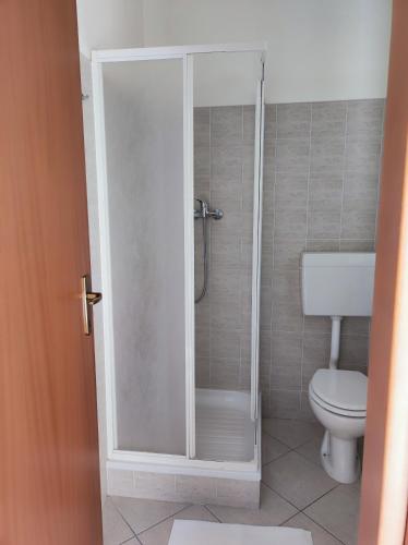 a bathroom with a shower with a toilet at Nonno Pierino affittacamere in Civitella Casanova