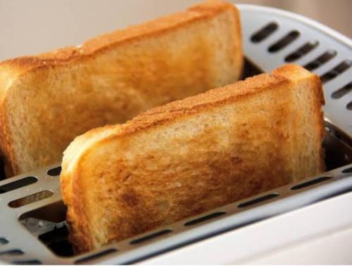 two slices of toast in a toaster basket at The Focus Khaoyai Resort in Mu Si