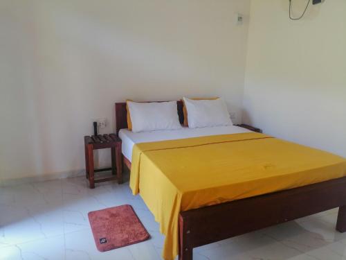 Ένα ή περισσότερα κρεβάτια σε δωμάτιο στο Forest & Fields Sinharaja - Where Nature Circles You